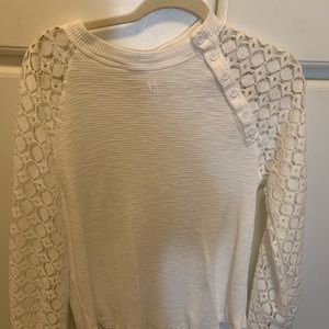 White blouse with button detail and detailed sleeves